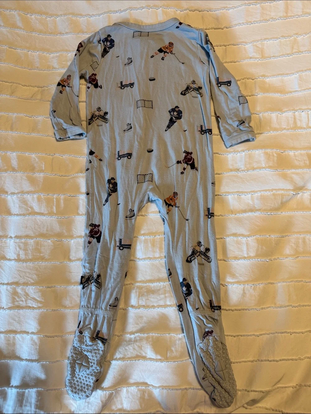 Kyte BABY 6-12 mo Light Blue Hockey & Skate Print Footed One-Piece